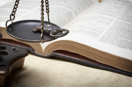 Scales weighing Key (Bible in background)
