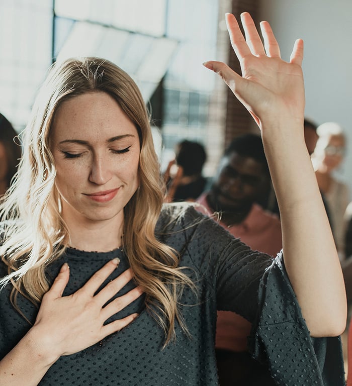 woman-raising-her-hand