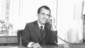 ”Nixon called the moon on a landline.” Very entertaining song. Share it with globers. 