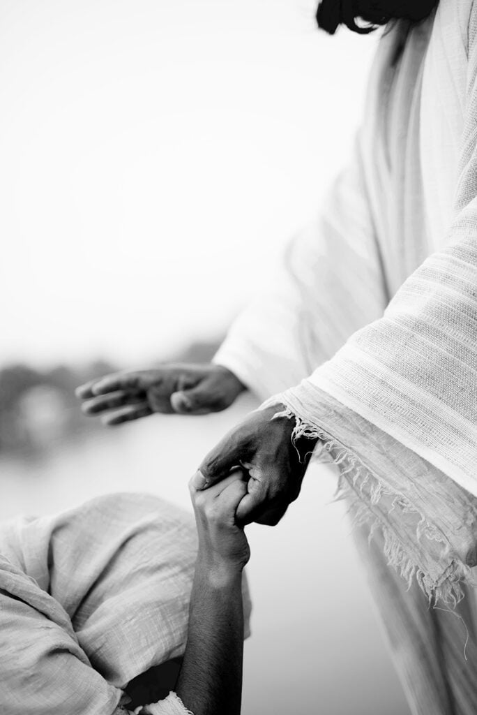 woman kneeling with Christ