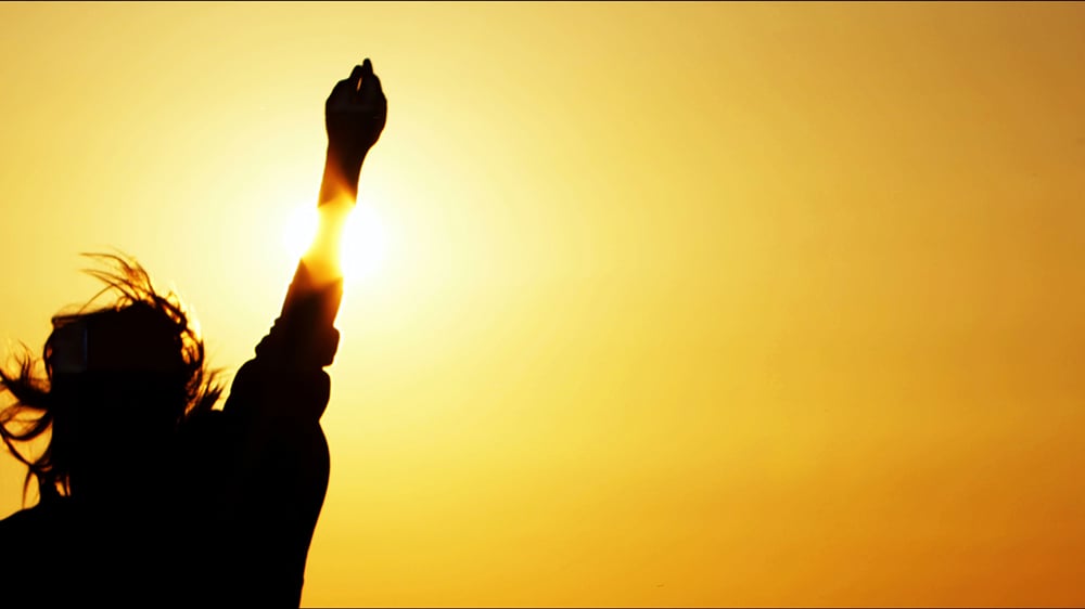 Young Woman Silhouette in Sunset