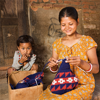 woman knitting with young child