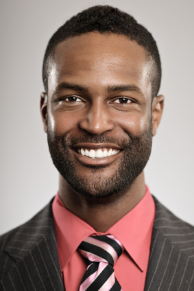 smiling man wearing a suit