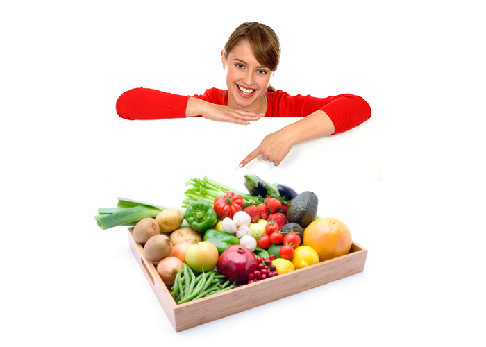 girl pointing to box of produce