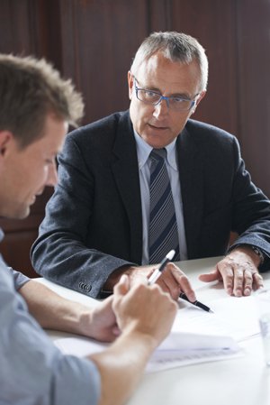 man receiving legal advice from a lawyer