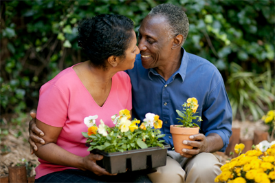 older couple in a flower garden
