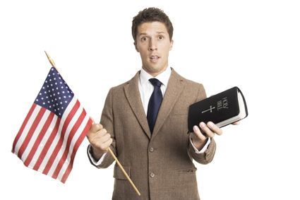 man holding American flag and Bible