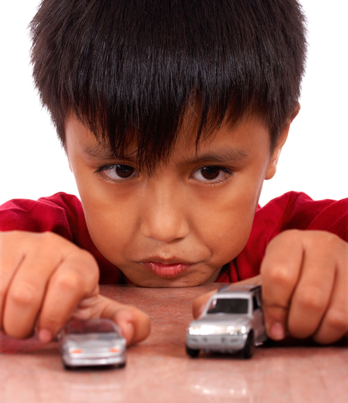 boy playing with cars