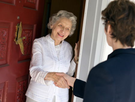 young man visiting elderly woman in the city