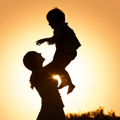 silhouette of a mother holding her child