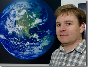 Robert Simmon in front of the Blue Marble