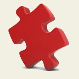 pièce de puzzle en 3D de couleur rouge, avec ombre projetée au sol, posée sur un côté et une tête.