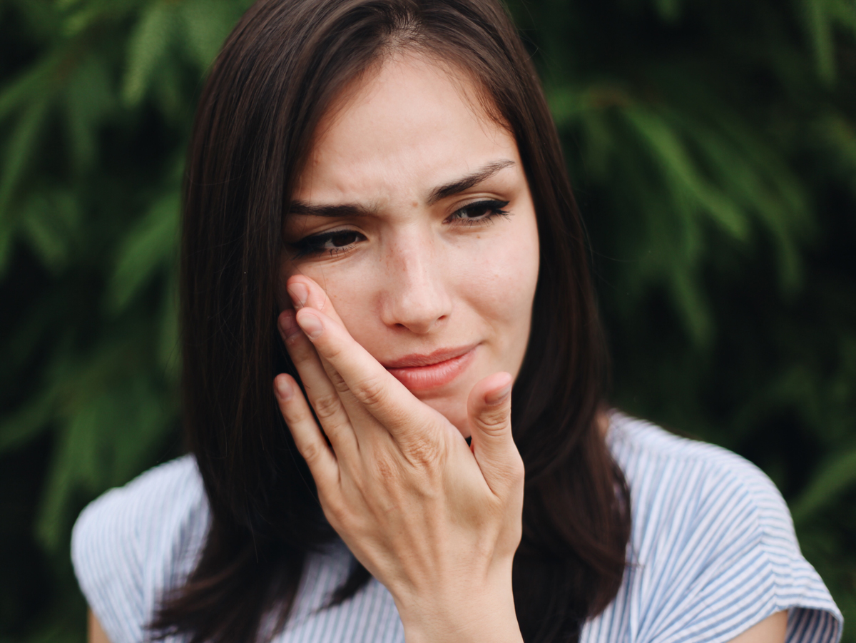 woman wiping away tears