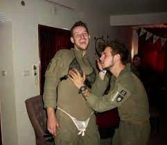 Israeli soldiers from the paratrooper brigades playing with underwear belonging to Palestinian women they displaced/killed.