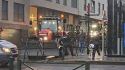 UNREAL SCENES: Police tried to stop the farmers from protesting outside the EU headquarters in Brussels. Farmers used their tractors to break through the police barriers.