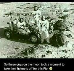 Moon Landing Hoax. Astronauts remove their helmets for a photo while on the moon landing.