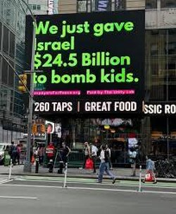 In NYC digital billboard: We just gave Israel $24.5 Billion to bomb kids.