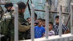 Palestinian children being arrested for walking on a Jewish only street in the West Bank.