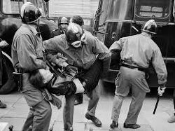 Paris Gestapo Police.  Imagine living in a world where you could get arrested , suspended or beat up  for saying don't kill children, because it might hurt the feelings of the killers. 