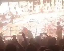 An Israeli band shows images of the genocide in Gaza in front of a happy crowd…We are dealing with MONSTERS!